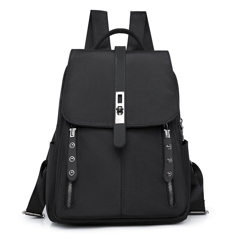 A black anti-theft buckle backpack with front lock and hidden back pocket, made of Oxford cloth and polyester, displayed against a plain background.