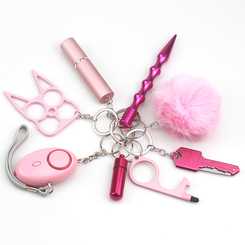 Travel-friendly self-defense keychain tools attached to matching lanyard, showing compact size and stylish color-coordinated design for women.