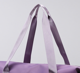 closeup of the handle of the expandable tote bag with removable wheels 