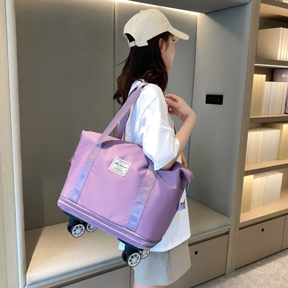 Woman carrying an Expandable tote bag with removable wheels on board an airplane
