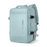Expandable travel backpack in light blue, water-resistant with multiple compartments, feminine style, TSA zipper access, laptop pocket, shoe and wet item sections, and USB charging port. 
