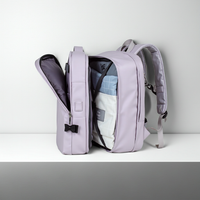 Extendable travel backpack in purple with open compartments, water-resistant with multiple compartments, TSA zipper access, laptop pocket, shoe and wet item sections, and USB charging port.