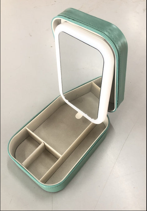 A LED makeup mirror with storage compartments, displayed in a green color, partially opened to show the mirror and storage space.