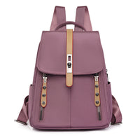 Anti-theft buckle backpack in dusty rose pink, with hidden back pocket and front lock, lightweight and compact for travel or daily use.