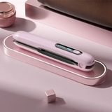 Pink wireless USB hair straightener on a pink background