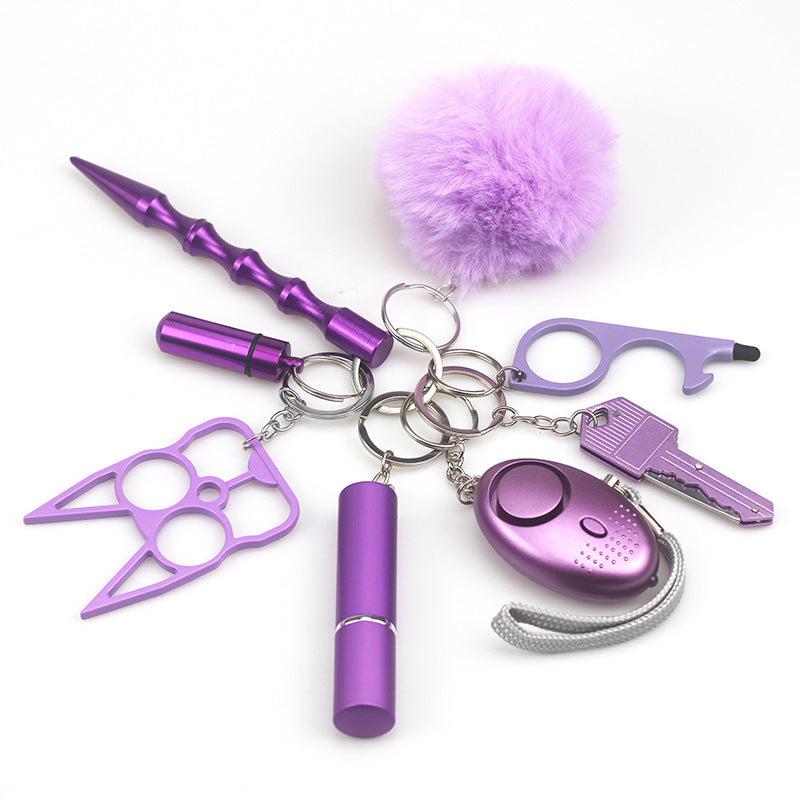 Travel-friendly self-defense keychain tools attached to matching lanyard, showing compact size and stylish color-coordinated design for women.