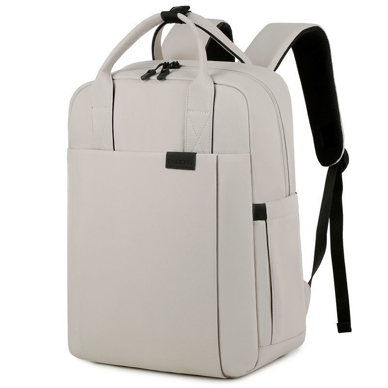 White backpack with black straps on a white background