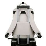 Backpack attached to a suitcase on a white background