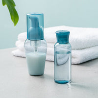 aesthetic refillable blue travel skincare bottles