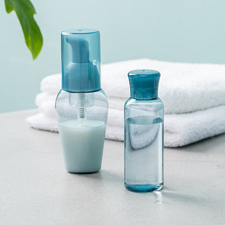aesthetic refillable blue travel skincare bottles