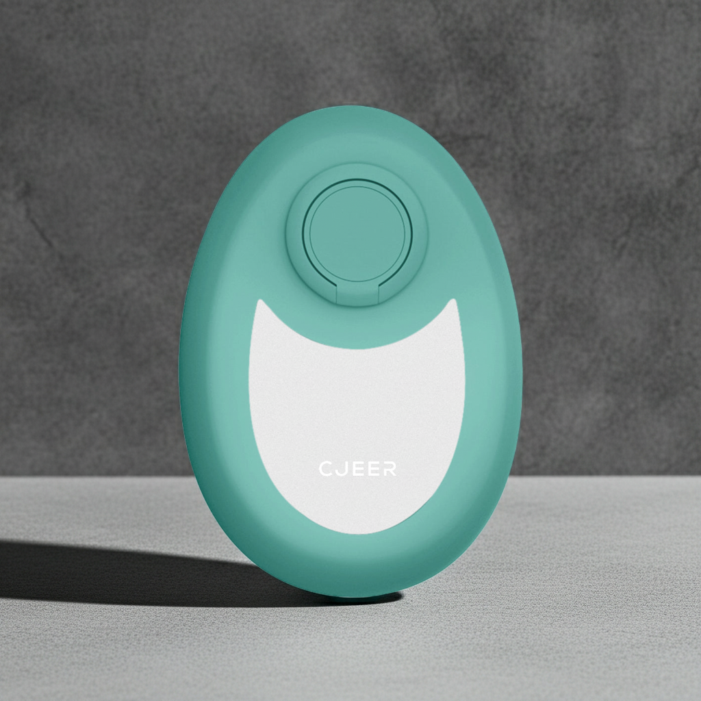 Crystal smooth skin hair remover with nano-glass surface in teal, compact handheld hair removal tool with ergonomic finger ring, shown in a clean minimalist setting.