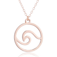 A rose gold wave pendant necklace on adjustable stainless steel chain, ocean-inspired jewelry.