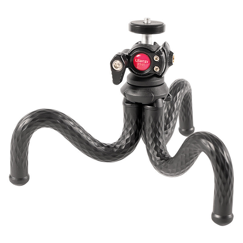 A black flexible octopus-shaped phone tripod with a mount and phone clip, made of TPR, ABS, and aluminum alloy. 