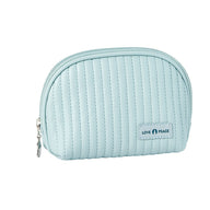 A hand holding a medium-sized beige cosmetic bag with a smooth metal zipper and a brand label reading 'Lush Faced'. The bag has a shell-like design and appears to be made of PU leather.