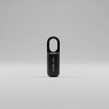 Black smart fingerprint USB charge lock on a white surface with a neutral background