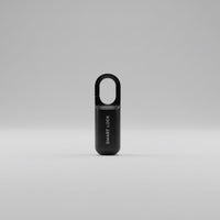 Black smart fingerprint USB charge lock on a white surface with a neutral background