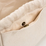 Details of the Beige cotton canvas bag organizer with multiple pockets, Japanese minimalist design, available in drawstring or zipper closure, shown in small/medium/large sizes.