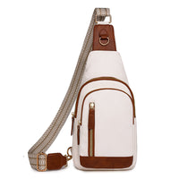 A white and brown chic retro cross body bag with a textured strap and multiple compartments.